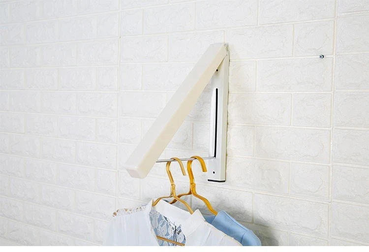 Convenient folding clothes drying rack with sturdy plastic and steel construction, providing generous hanging space for laundry in small living spaces.