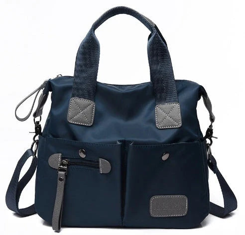 Versatile ladies shoulder bag with multiple carry options, numerous pockets, and durable Oxford fabric construction