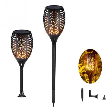 Elegant solar-powered garden lights illuminating a pathway in a lush British garden