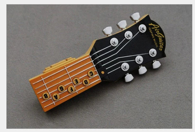 Innovative infrared guitar with chord selection buttons, adjustment controls, and tilt sensor for effortless string-free musical expression