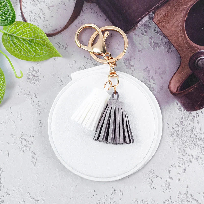 Mini round PU leather small mirror with lovely tassel in various colours