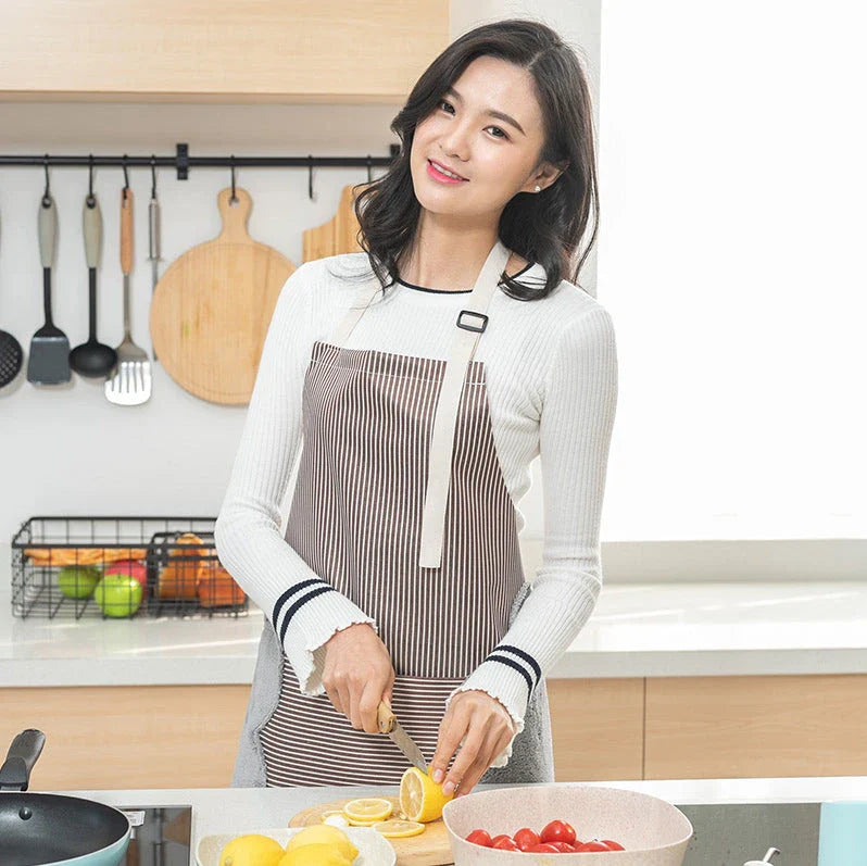 Stylish water-resistant apron with adjustable neck strap, front pockets, and durable Oxford cloth and polyester velvet construction
