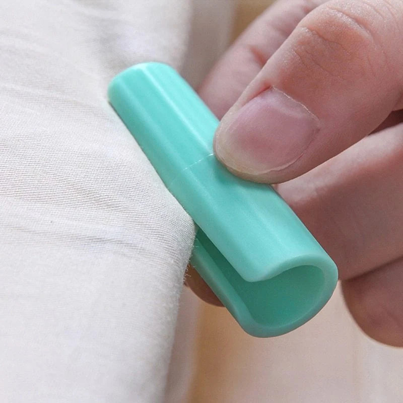 Non-slip sheet fixing clips in various colours for securing bedding and cushions