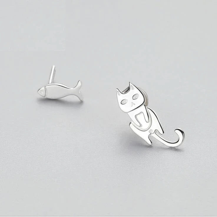Elegant asymmetric 925 sterling silver stud earrings with cat and fish motifs, a modern and sophisticated accessory
