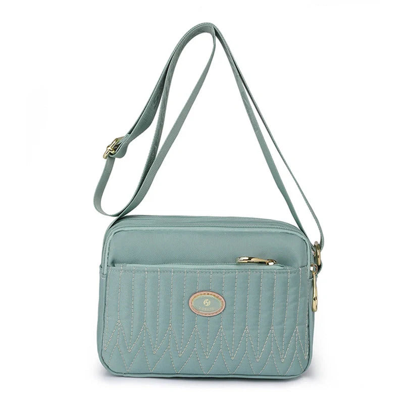 Women's lightweight nylon cross body messenger bag in various colours