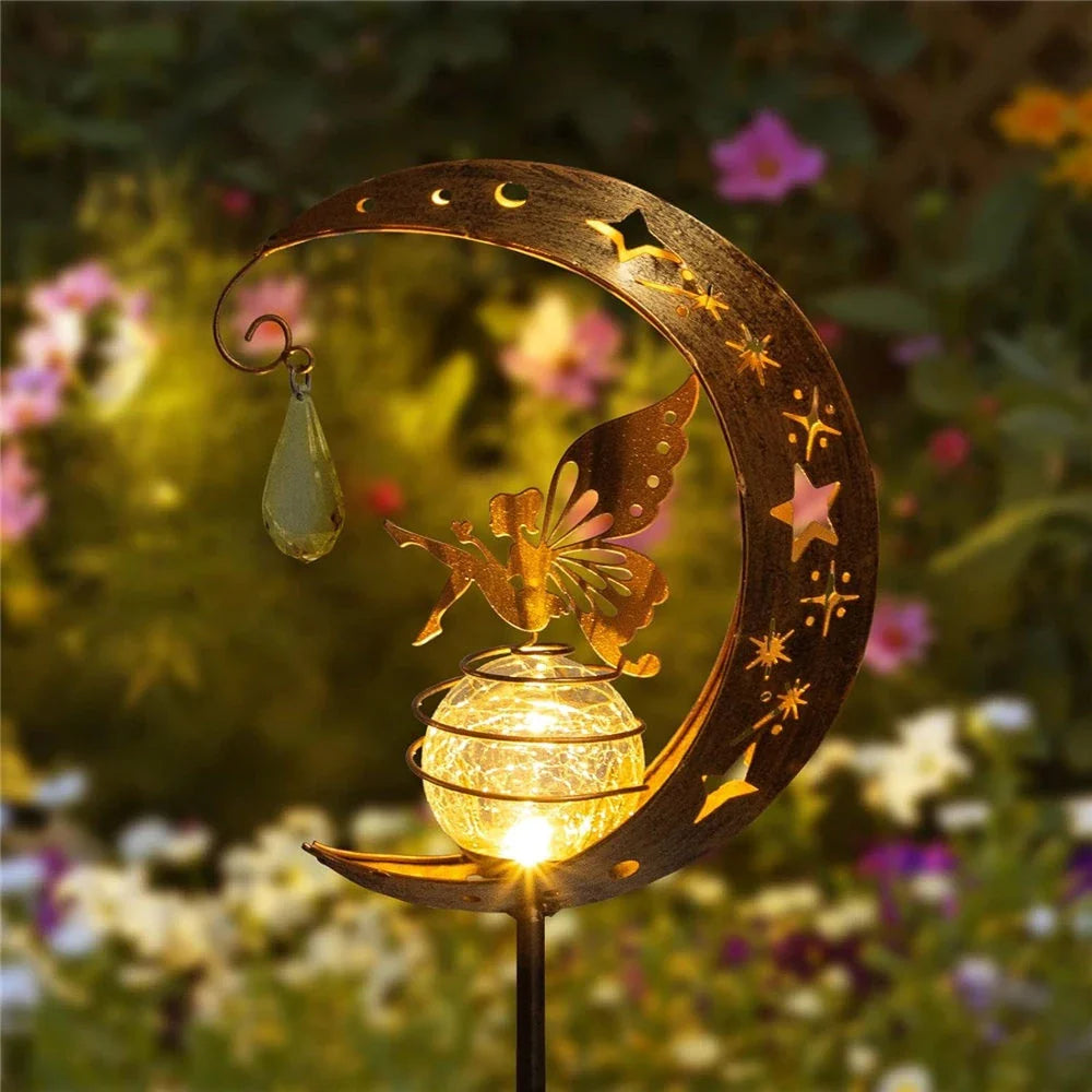 Enchanting solar-powered garden light with fairy and moon design, ideal for illuminating pathways, patios, and outdoor spaces