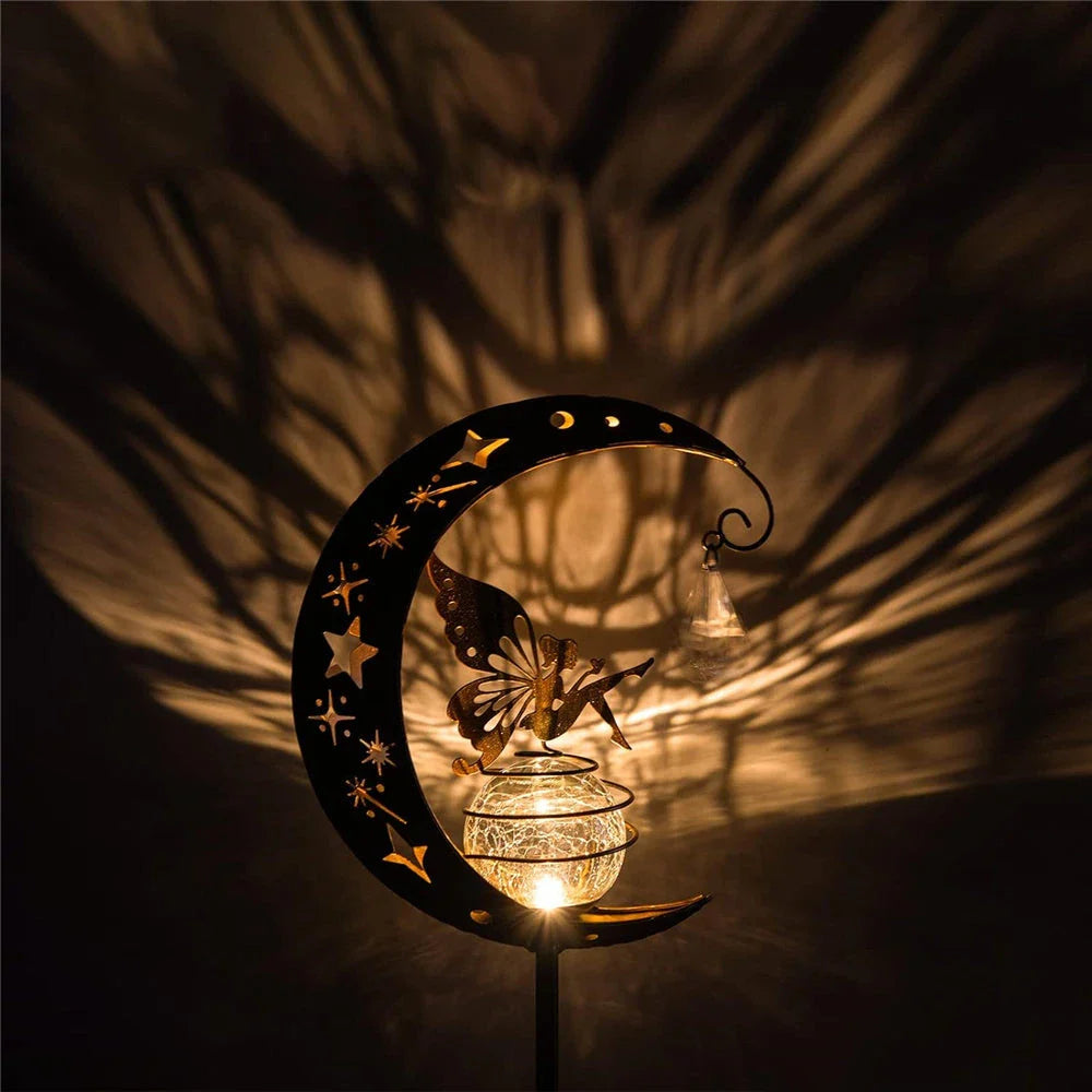 Enchanting solar-powered garden light with fairy and moon design, ideal for illuminating pathways, patios, and outdoor spaces
