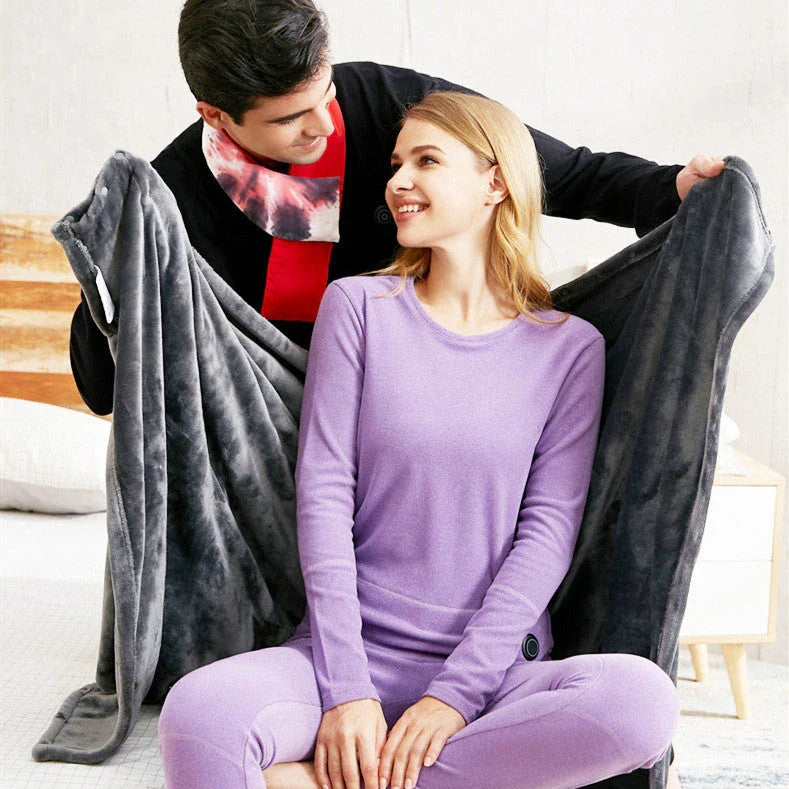 Cozy electric heated blanket made of soft, plush coral fleece with adjustable temperature settings and USB connectivity for portable warmth