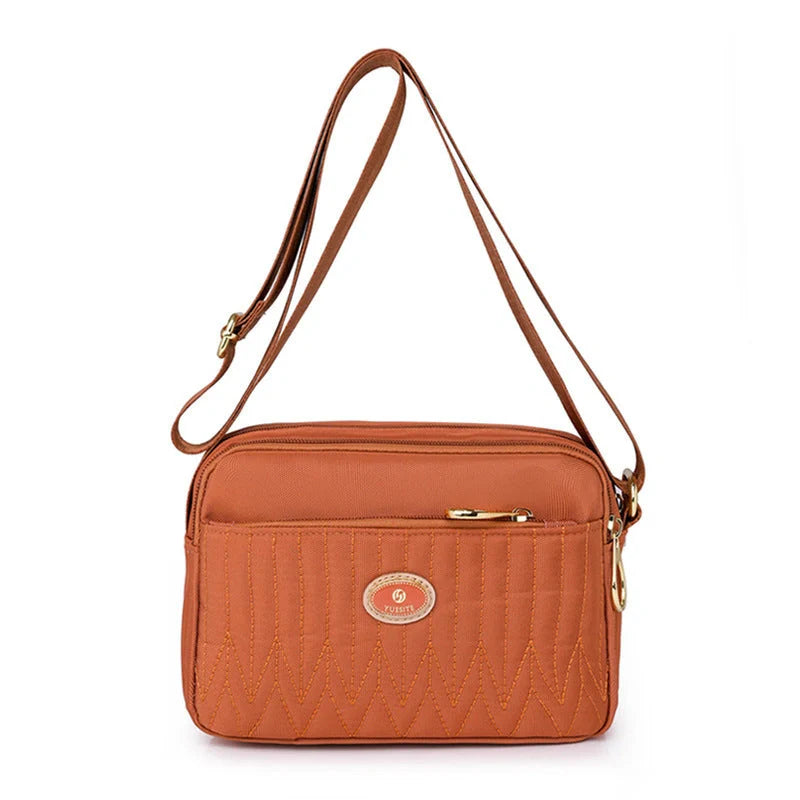Women's lightweight nylon cross body messenger bag in various colours