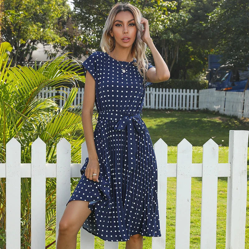 Stylish polka dot midi dress with short sleeves, pleated skirt, and hidden lining for a smooth, non-see-through fit