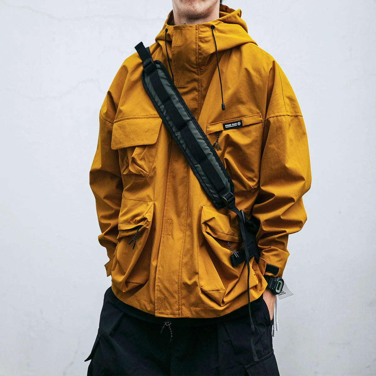 Men's hooded jacket in black, yellow, or green with windproof feature and three-dimensional pockets