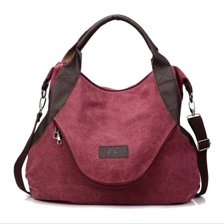 Stylish and versatile canvas shoulder bag with premium brass hardware and thoughtful interior organisation