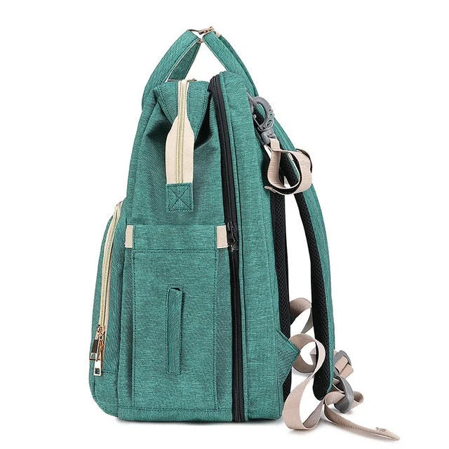 Portable folding crib and mummy bag in green and grey, compact design for baby travel