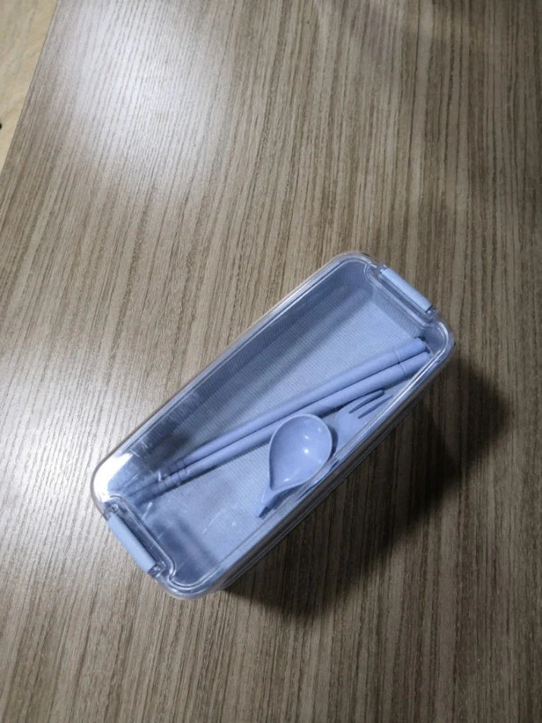 A stylish microwave-safe lunch box with a removable soup mug in various colours, including pink, green, and apricot