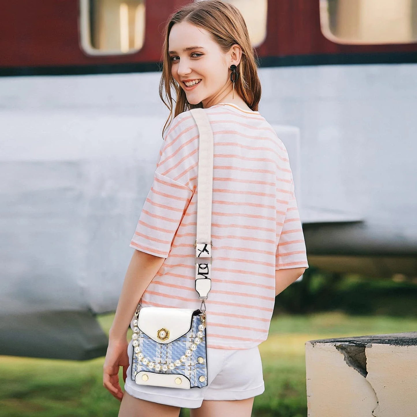 Premium crossbody phone bag with elegant pearl charm, made of durable PU leather and available in multiple color options