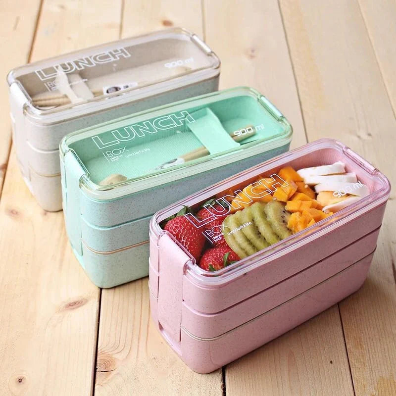 A stylish microwave-safe lunch box with a removable soup mug in various colours, including pink, green, and apricot