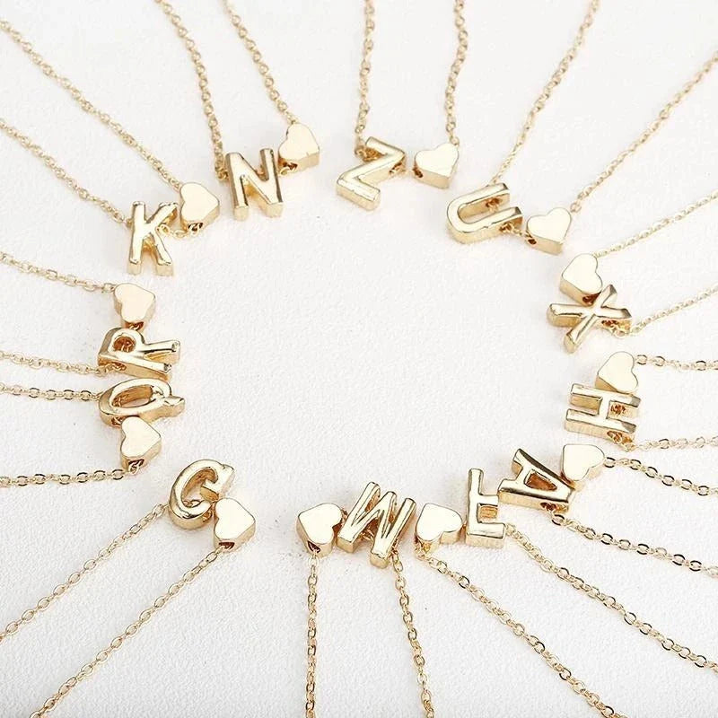 Heart-shaped pendant necklace with adjustable chain in various metallic finishes