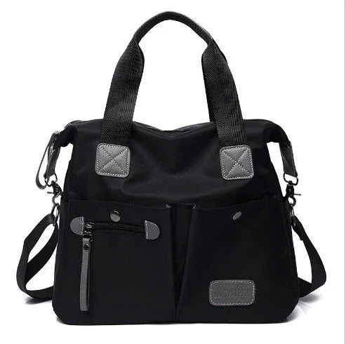 Versatile ladies shoulder bag with multiple carry options, numerous pockets, and durable Oxford fabric construction