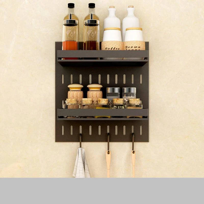 A high-quality stainless steel wall-mounted kitchen storage rack with a perforated design for customisable storage