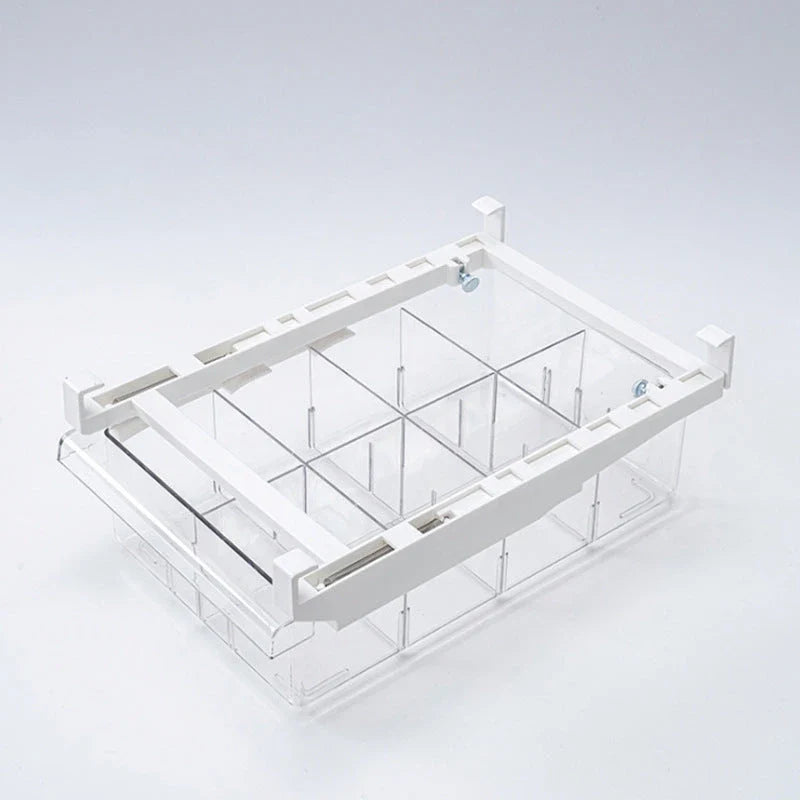 Transparent rectangular storage box with modular grid system for organised storage in kitchen or office