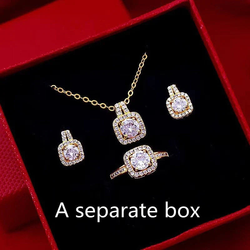 Elegant gold-toned jewelry set with zircon gemstone pendant necklace, stud earrings, and statement ring