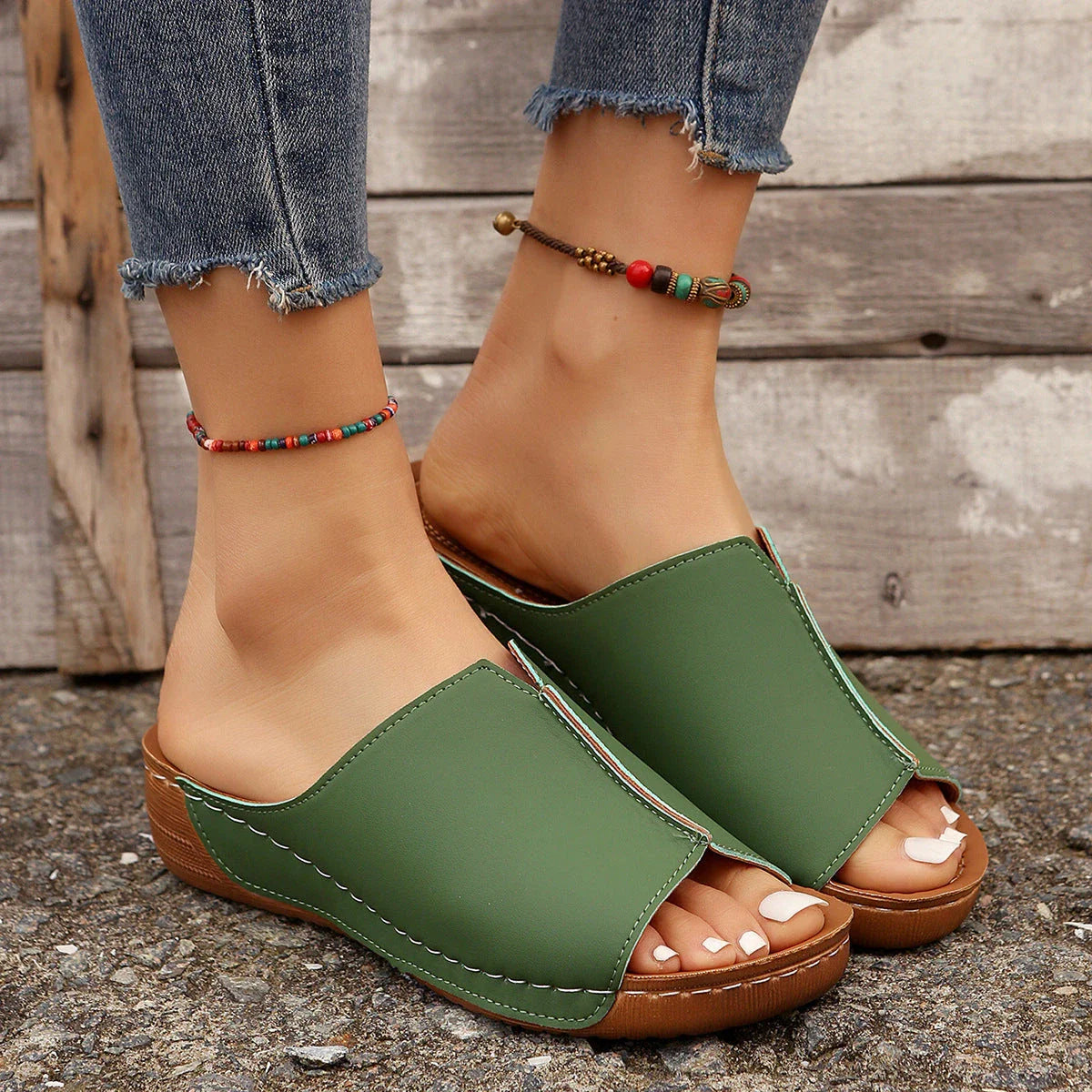 Fashionable wedge sandals in a variety of colors, featuring a peep-toe design and thick, durable soles for comfort and style