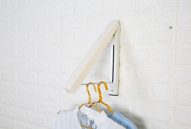 Convenient folding clothes drying rack with sturdy plastic and steel construction, providing generous hanging space for laundry in small living spaces.
