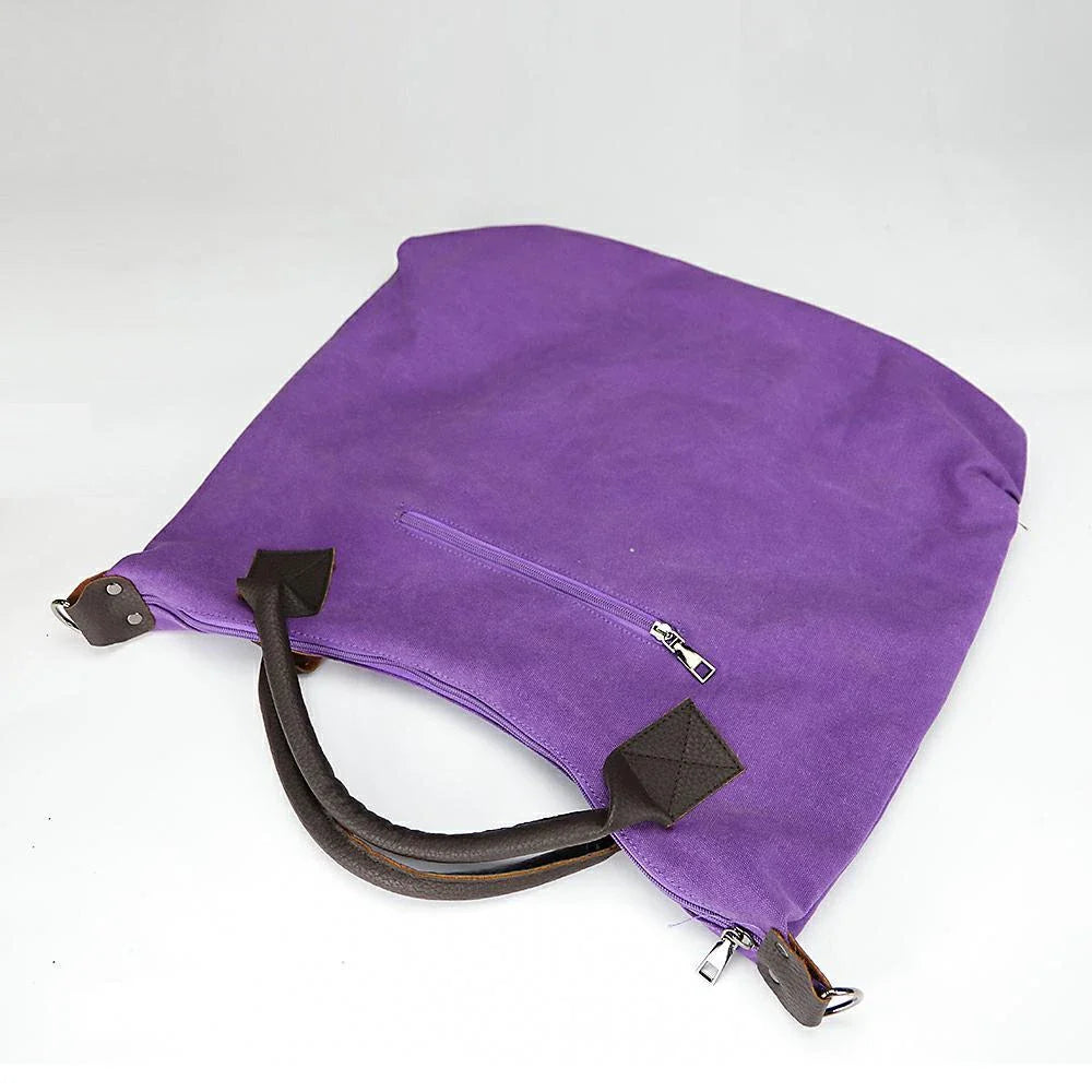 Stylish and versatile canvas shoulder bag with premium brass hardware and thoughtful interior organisation