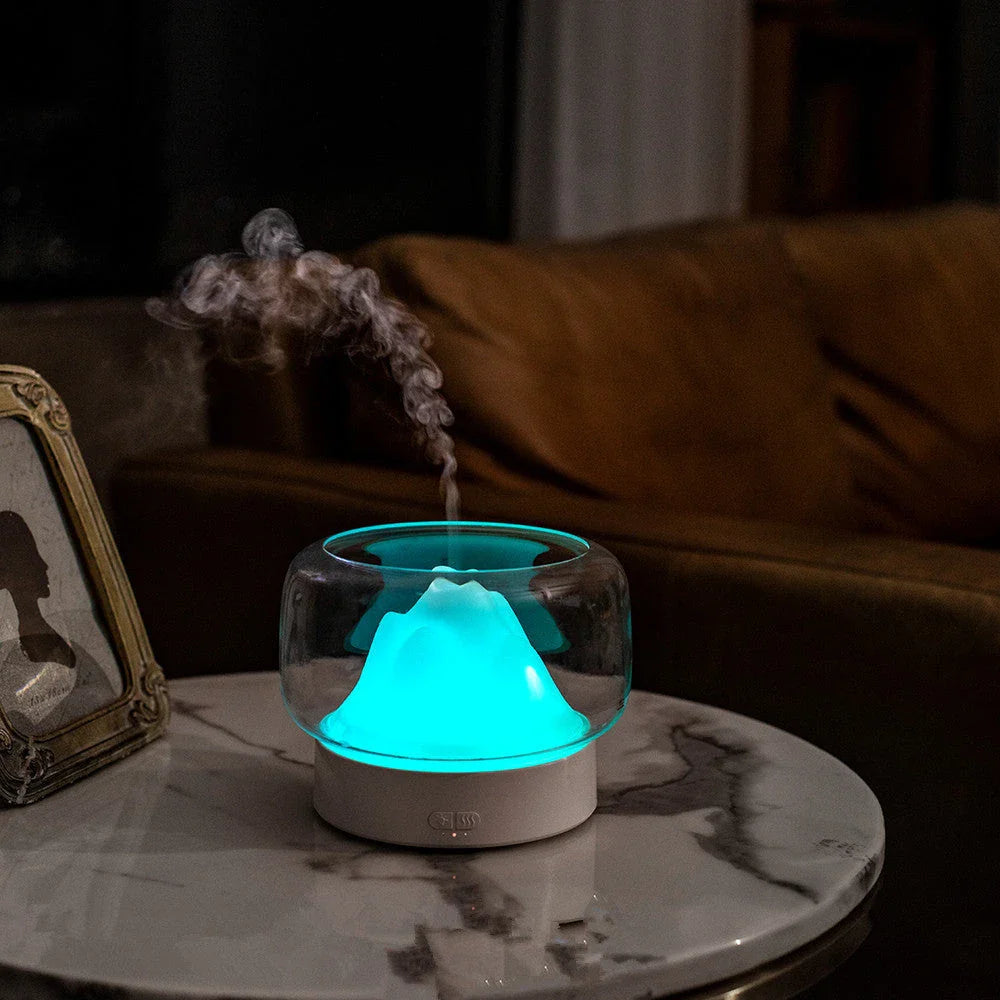 Premium aroma diffuser with serene mountain landscape design and multi-coloured night light for relaxation and well-being