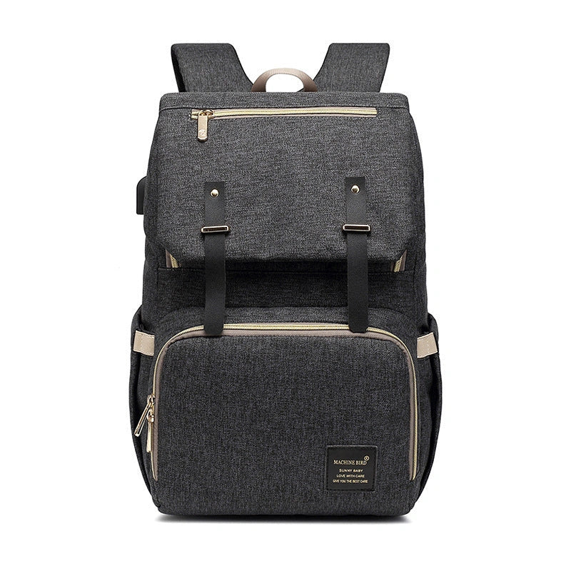 Versatile mummy bag with stroller hooks, side pockets, and zippered compartments for storing baby essentials