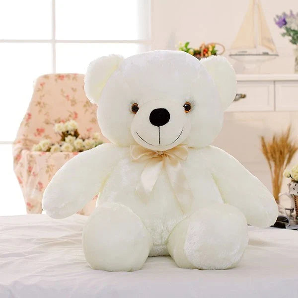 A soft and cuddly teddy bear plush toy with captivating color-changing LED lights, perfect for bringing wonder and delight to a child's room.