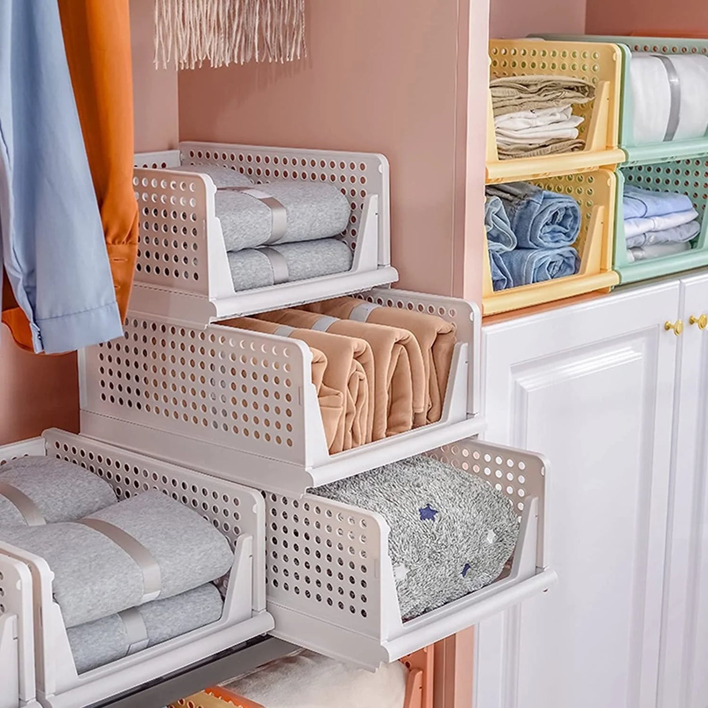Stackable plastic clothes storage drawers in white, available in various sizes for customisable organisation