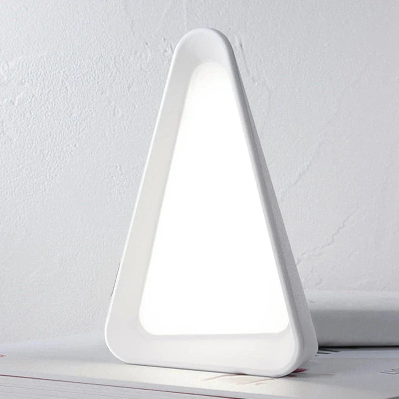 Adjustable flip-up LED night light with USB charging, dimmable brightness, and compact, creative design perfect for desks or bedside tables