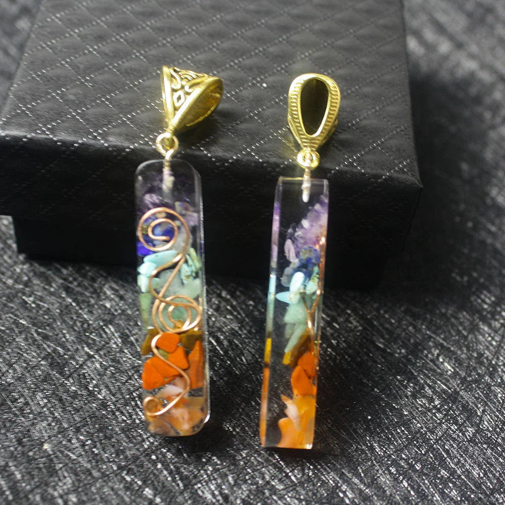 A stunning chakra crystal pendant with natural patterns and organic imperfections, showcasing the beauty of nature.