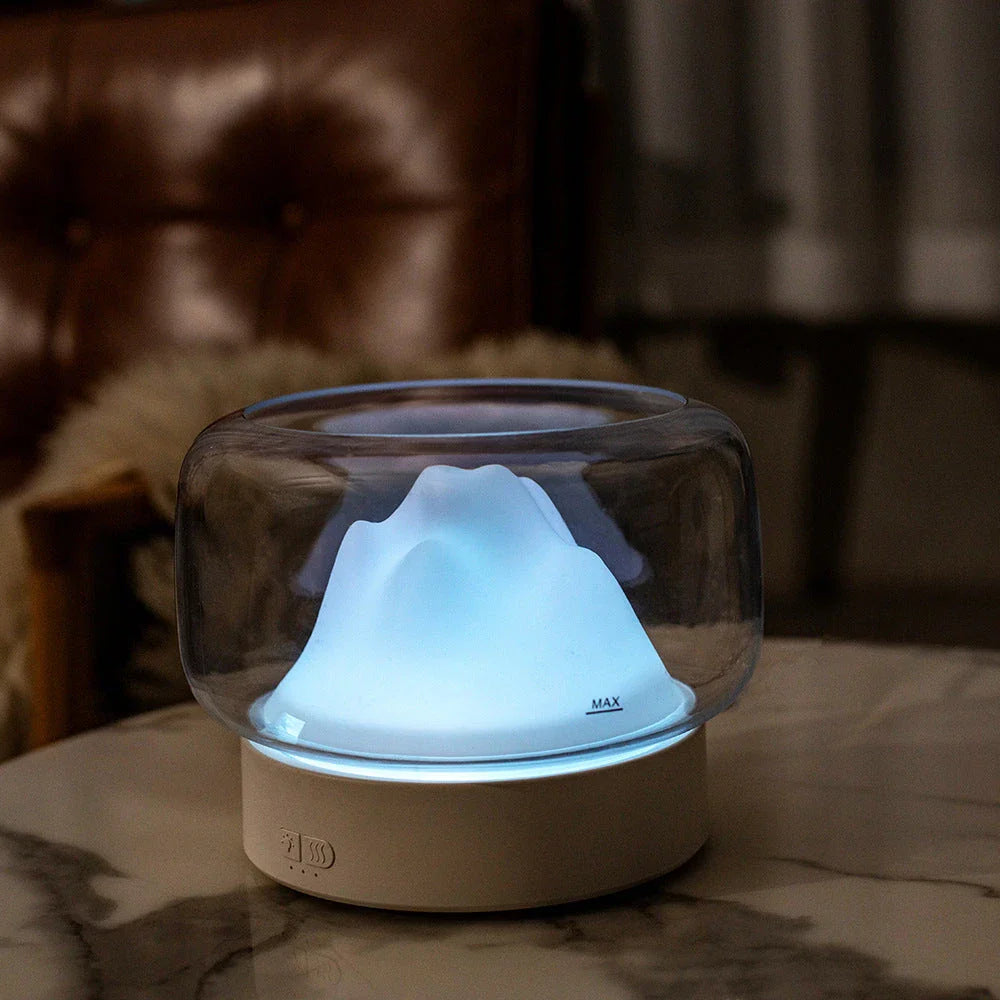 Premium aroma diffuser with serene mountain landscape design and multi-coloured night light for relaxation and well-being