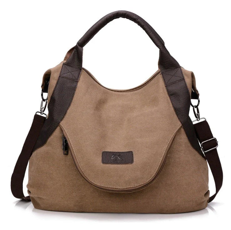 Stylish and versatile canvas shoulder bag with premium brass hardware and thoughtful interior organisation