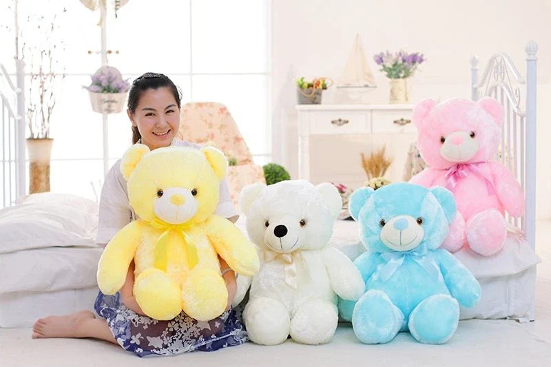 A soft and cuddly teddy bear plush toy with captivating color-changing LED lights, perfect for bringing wonder and delight to a child's room.