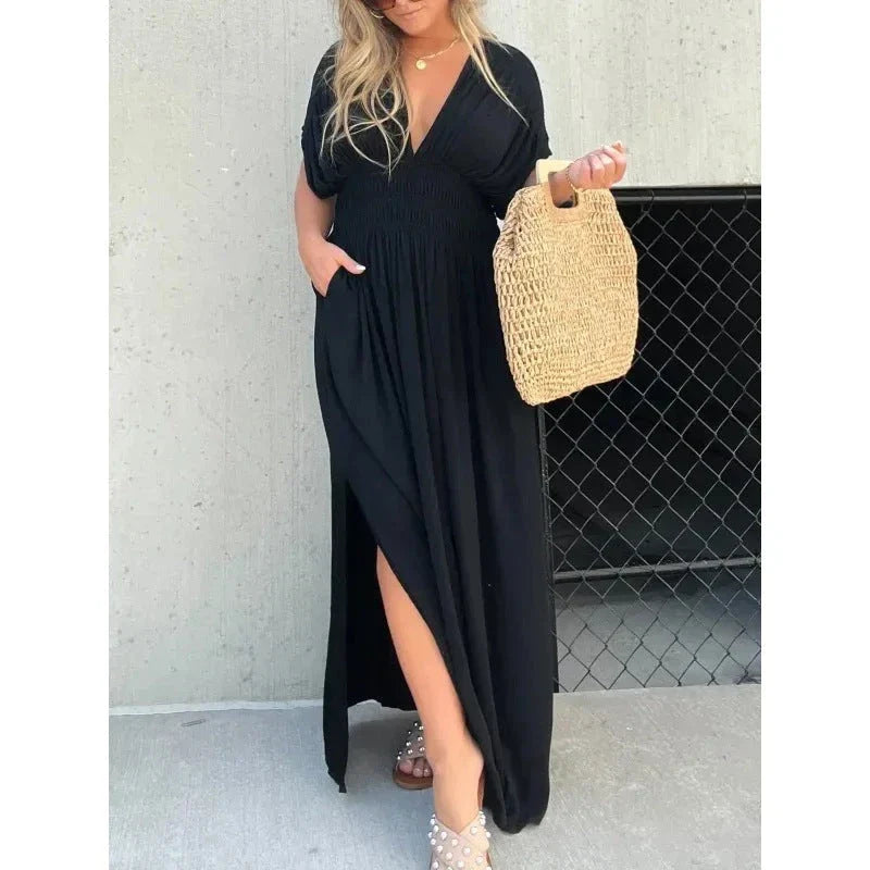 Chic bat-sleeve dress with v-neck, side slit, and elastic waist for comfortable summer style
