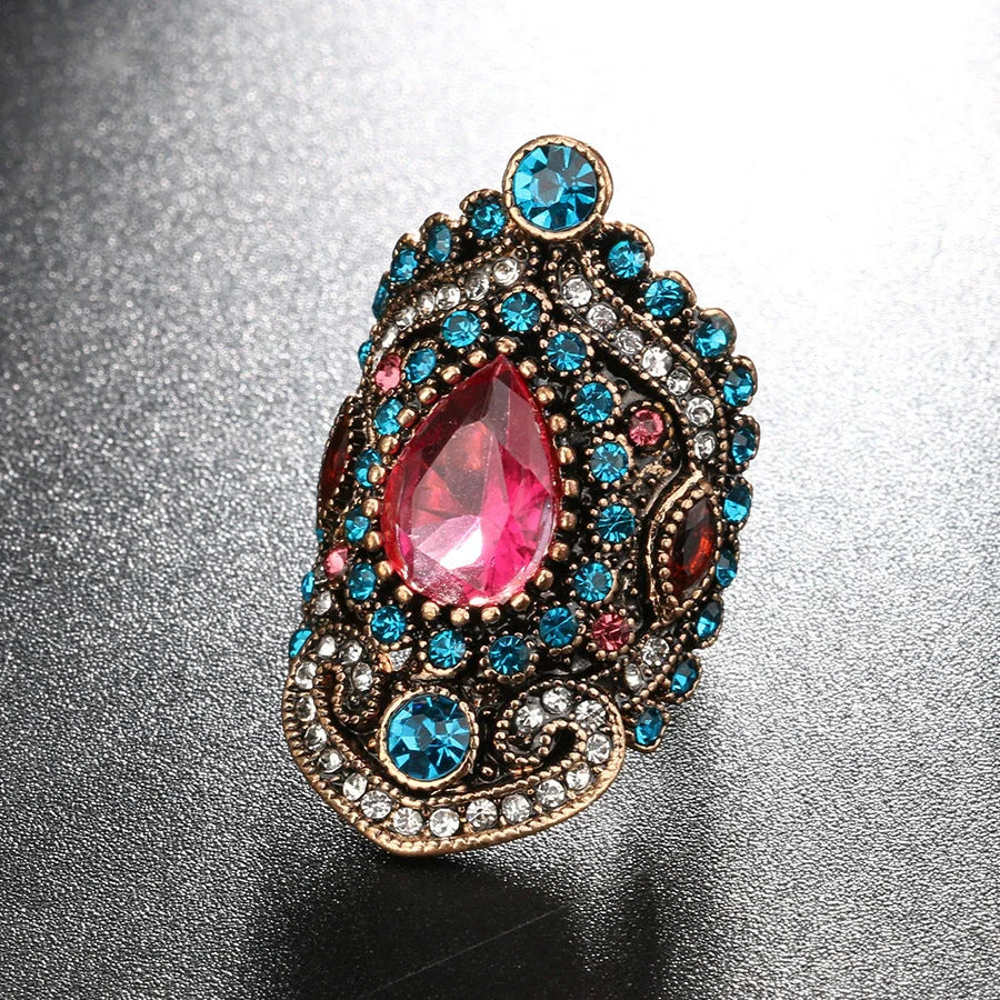 Elegant bohemian-style jewellery set featuring necklaces, earrings, and rings in a variety of colours and sizes