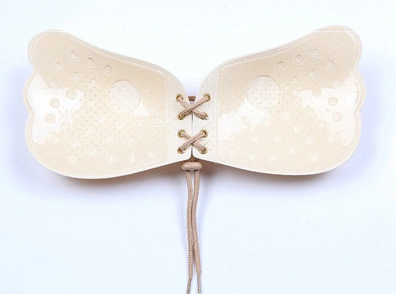 Adhesive strapless bras for women in various colours and sizes, designed for seamless support and a flawless look under backless, low-cut, and strapless dresses.