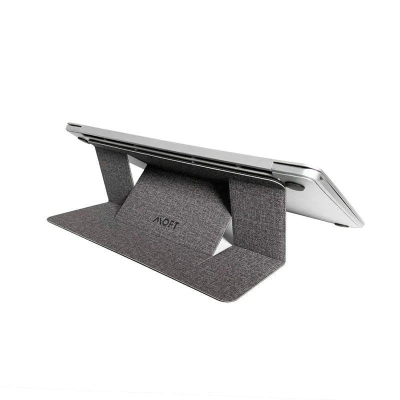 Adjustable laptop stand with adjustable height, anti-slip surface, and cable management for improved ergonomics and productivity