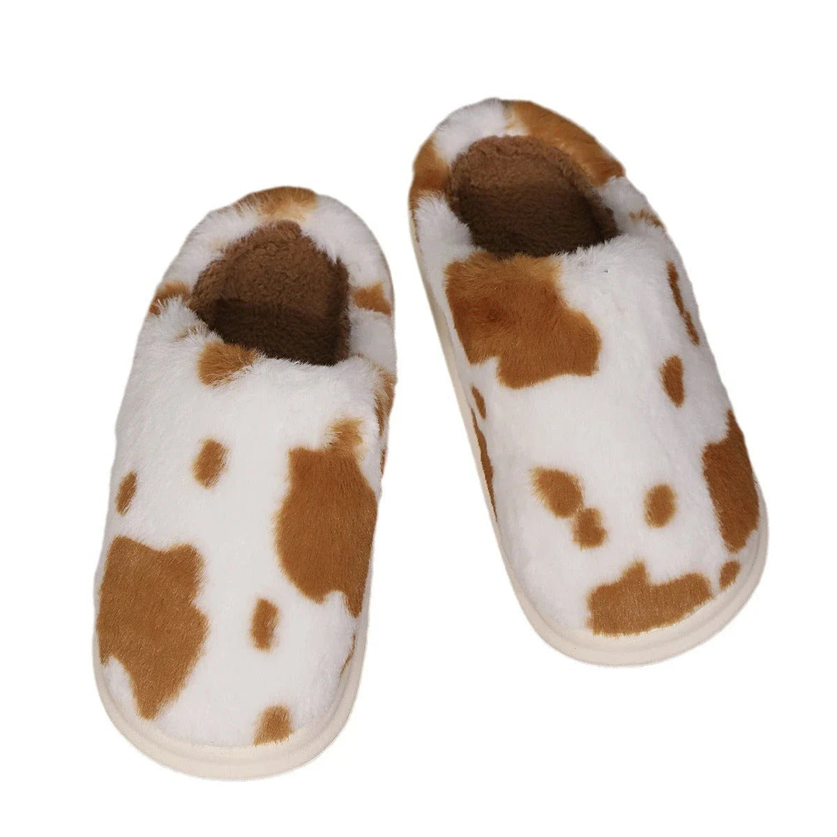 Cozy cow print plush slippers with a non-slip sole, perfect for indoor comfort and warmth