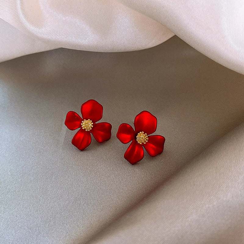 Elegant silver earrings with delicate red petal design inspired by Korean fashion