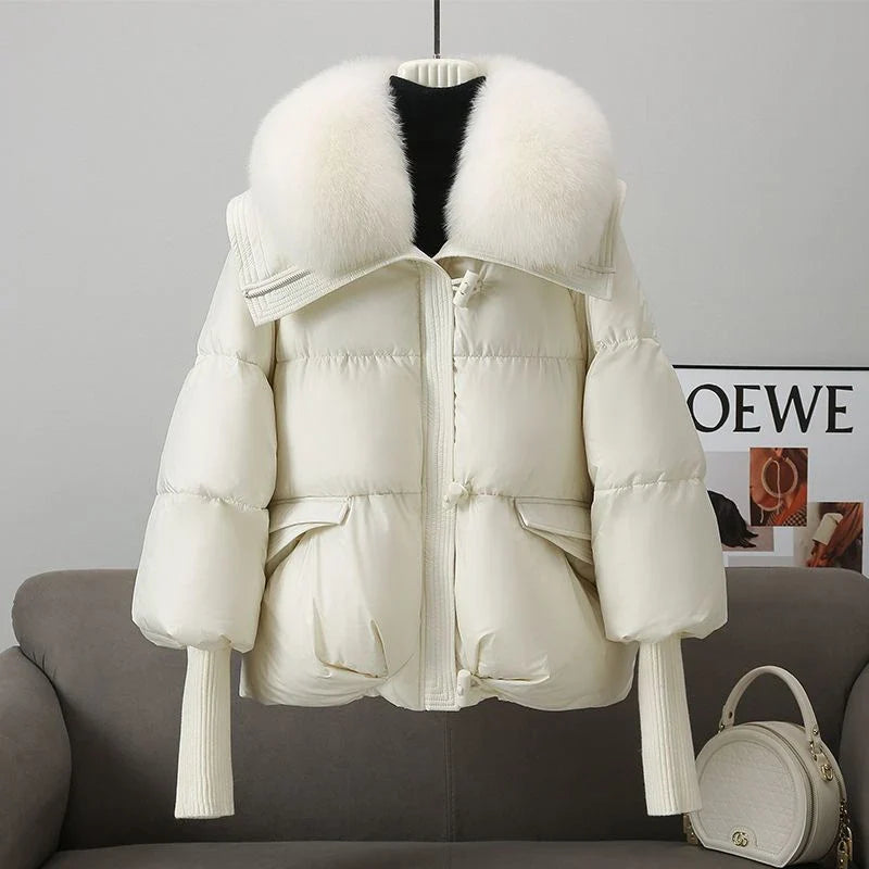 Premium down-filled puffer jacket with faux fur collar, available in brown, black, and white colours