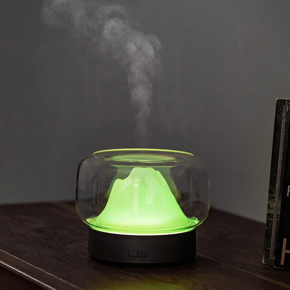 Premium aroma diffuser with serene mountain landscape design and multi-coloured night light for relaxation and well-being