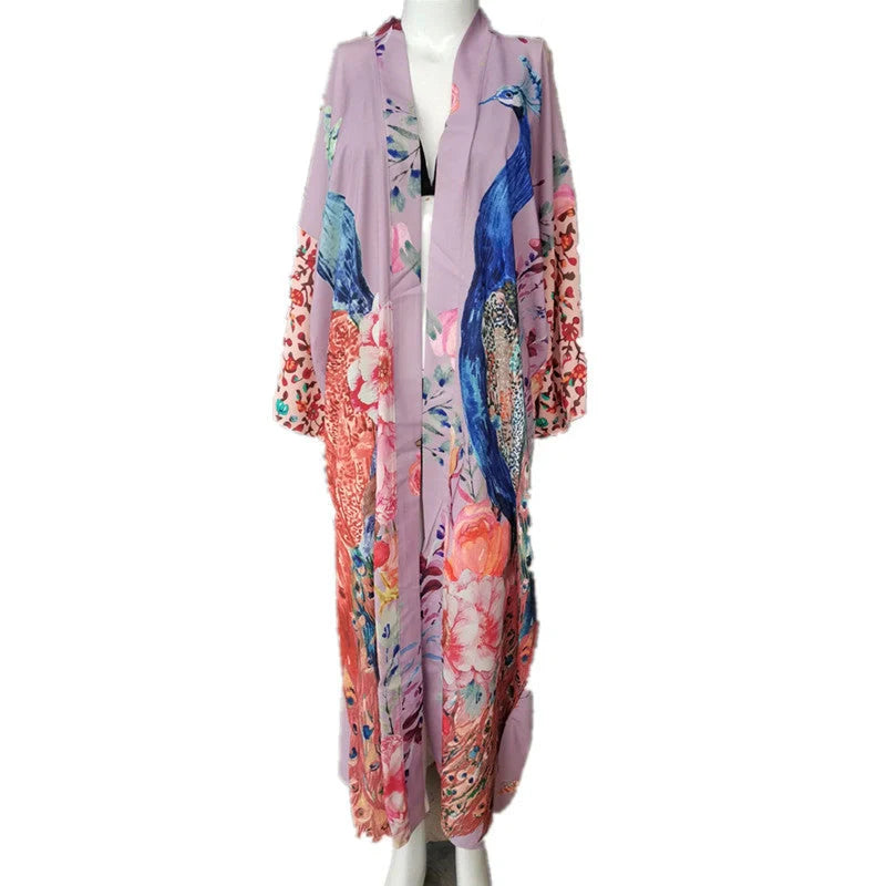 Elegant peacock-printed beach cover-up with lightweight, breathable fabric for stylish sun protection