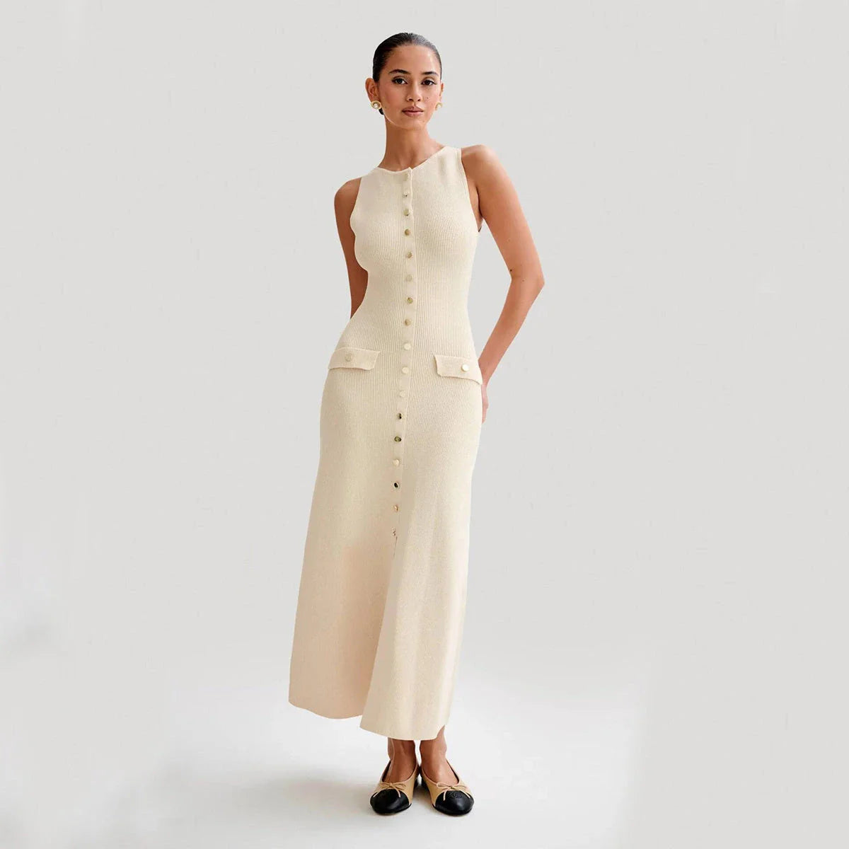 Sophisticated knit sleeveless dress with a slim, figure-flattering silhouette in apricot and blue colors