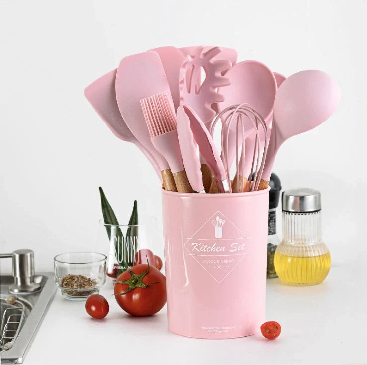 Silicone kitchenware set with wooden handles in various colors and styles, perfect for cooking, baking, and serving