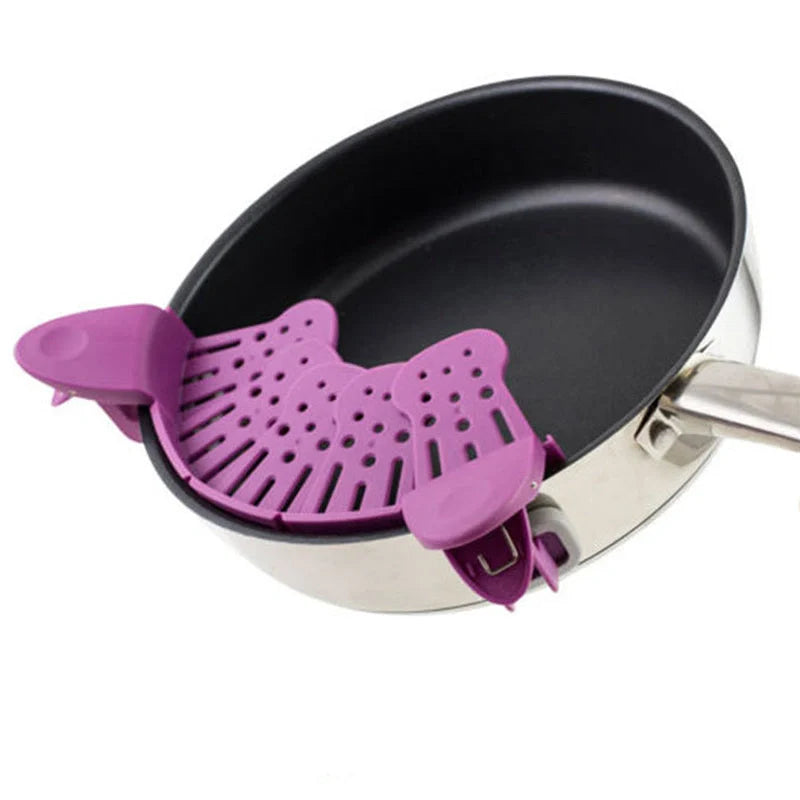 Universal Silicone Clip-on Pan Pot Strainer in purple and green, showcasing its compact design and clip mechanism