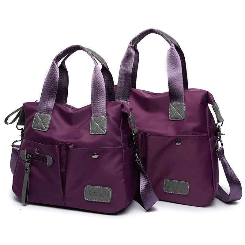 Versatile ladies shoulder bag with multiple carry options, numerous pockets, and durable Oxford fabric construction